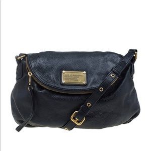 Marc by Marc Jacobs black crossbody bag with gold hardware and printed inside.
